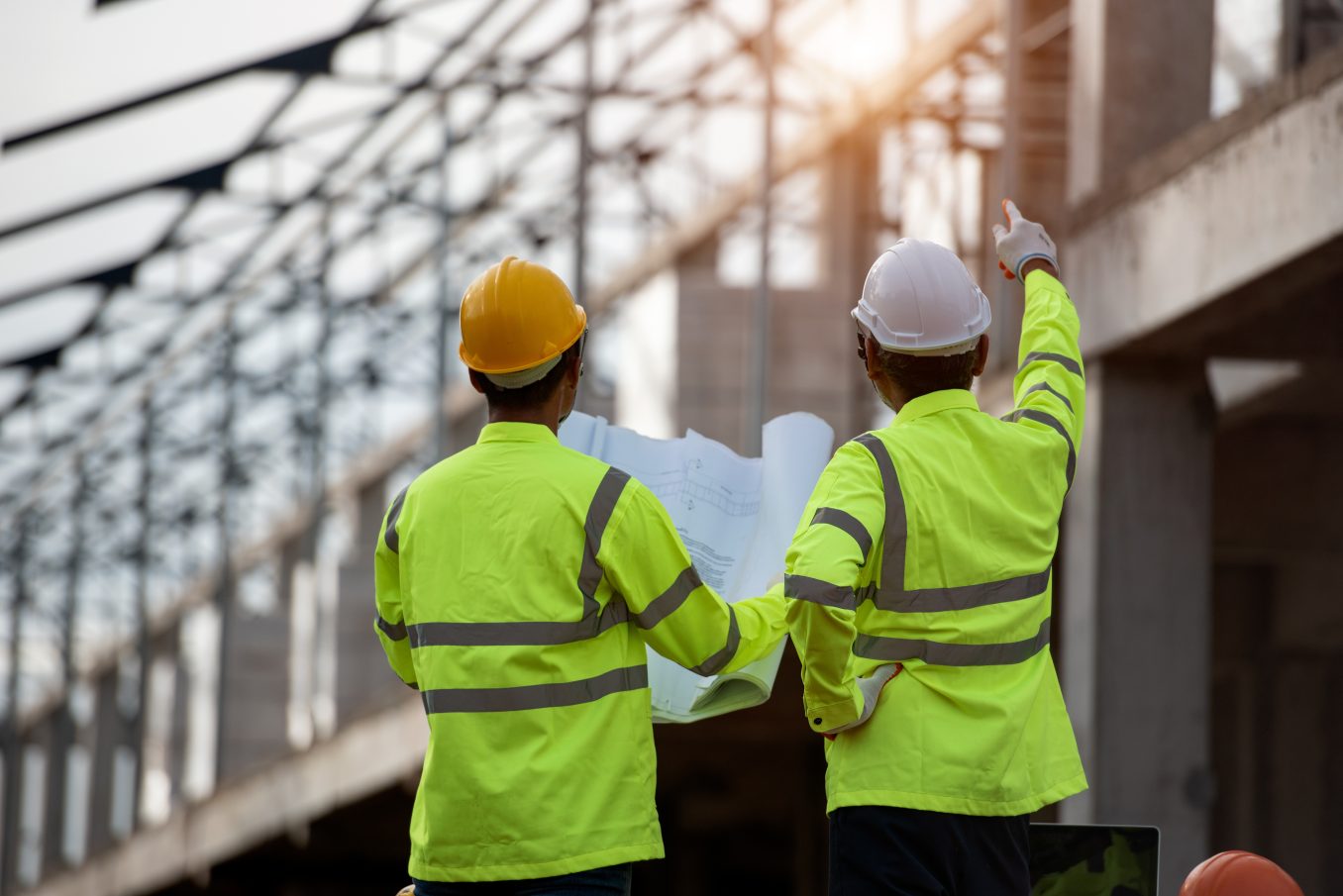 Construction workers assessing a construction site