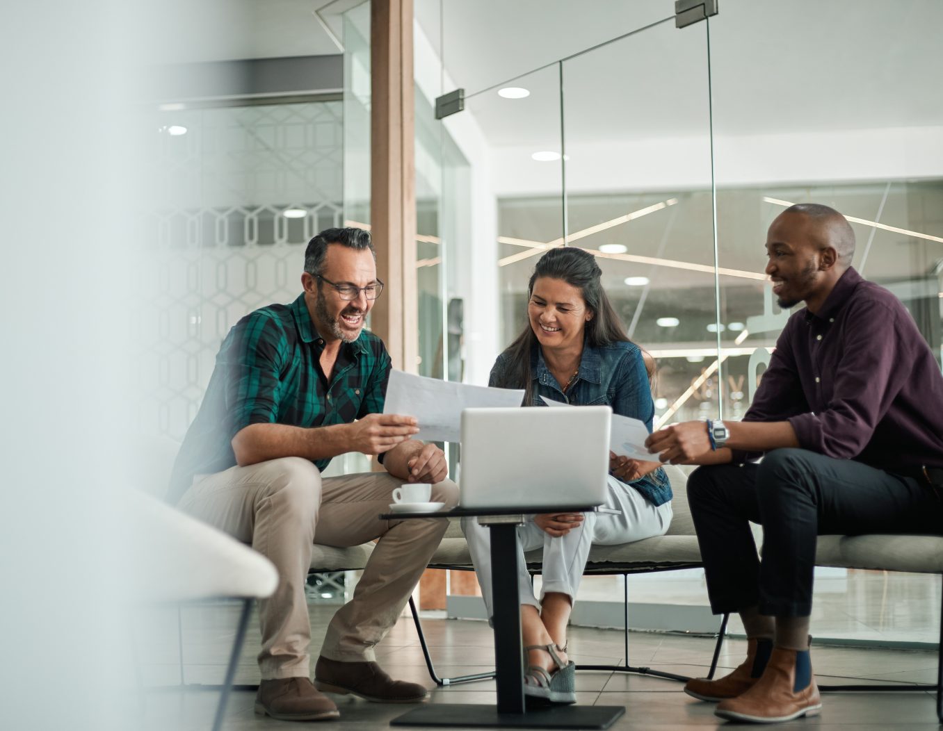 Casual meeting of smiling diverse business team